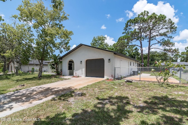 1384 Vancouver Ave SE, Palm Bay, FL 32909 - view of front of property featuring an attached garage, stucco siding, and concrete driveway