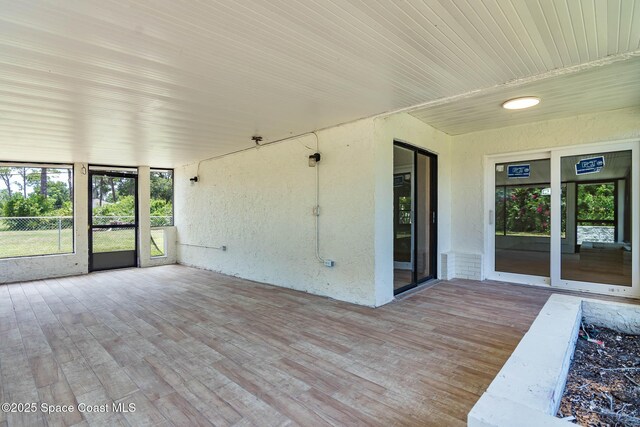 1384 Vancouver Ave SE, Palm Bay, FL 32909 - unfurnished sunroom featuring healthy amount of natural light