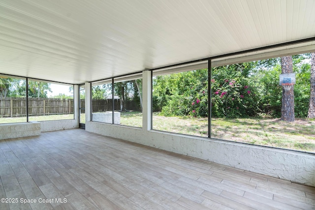 1384 Vancouver Ave SE, Palm Bay, FL 32909 - unfurnished sunroom featuring wood finished floors