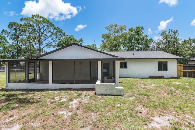 1384 Vancouver Ave SE, Palm Bay, FL 32909 - back of house with a sunroom and stucco siding