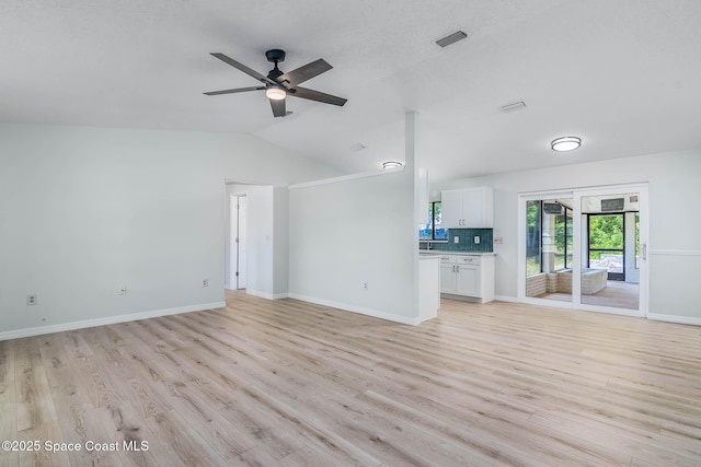 1384 Vancouver Ave SE, Palm Bay, FL 32909 - unfurnished living room featuring light wood-type flooring, ceiling fan, and lofted ceiling