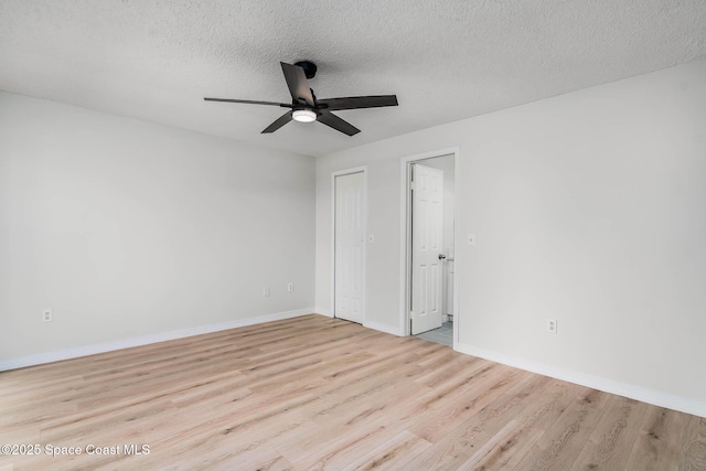 1384 Vancouver Ave SE, Palm Bay, FL 32909 - unfurnished bedroom with wood finished floors, a textured ceiling, a closet, and ceiling fan