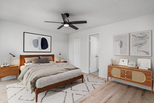 1384 Vancouver Ave SE, Palm Bay, FL 32909 - bedroom featuring wood finished floors, a textured ceiling, a ceiling fan, and a closet