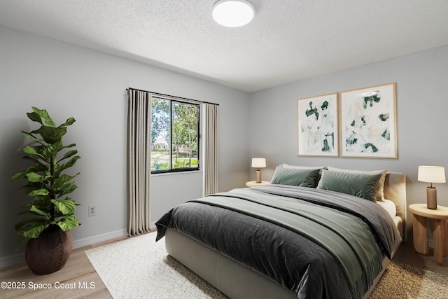 1384 Vancouver Ave SE, Palm Bay, FL 32909 - bedroom featuring light wood finished floors and a textured ceiling