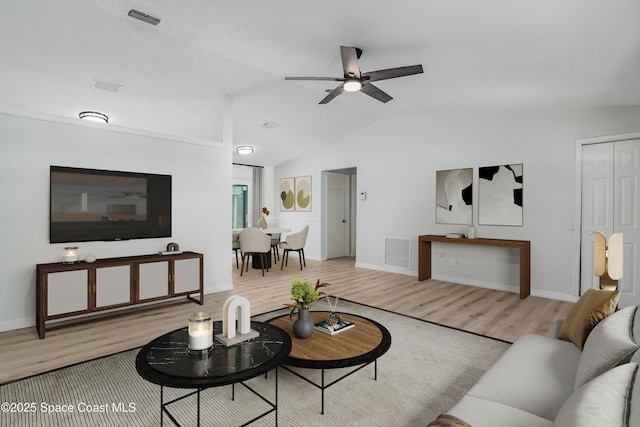 1384 Vancouver Ave SE, Palm Bay, FL 32909 - living area featuring a ceiling fan, wood finished floors, and lofted ceiling