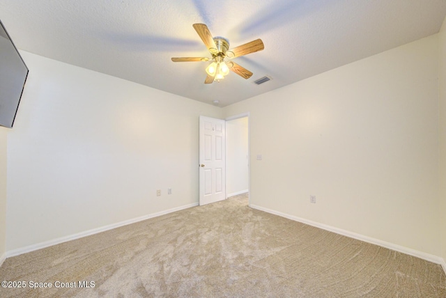 6980 Cairo Rd, Cocoa, FL 32927 - carpeted spare room featuring a ceiling fan and baseboards