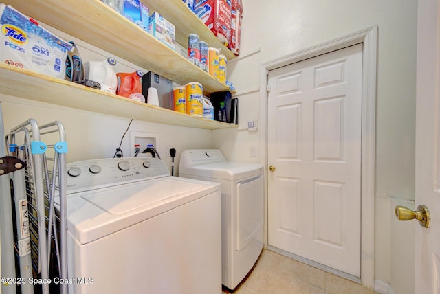 6980 Cairo Rd, Cocoa, FL 32927 - laundry room featuring washer and dryer and light tile patterned floors