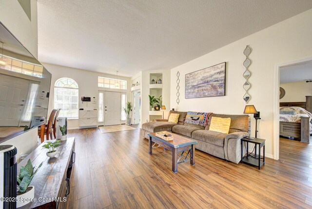 6980 Cairo Rd, Cocoa, FL 32927 - living area with wood finished floors and a textured ceiling