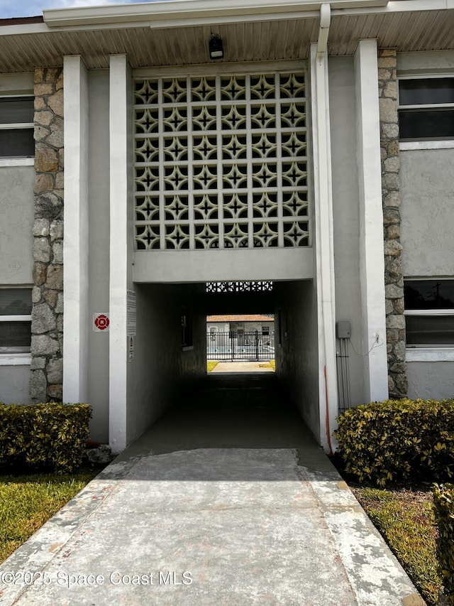 5600 N Banana River Blvd Unit 38, Cocoa Beach, FL 32931 - entrance to property featuring stone siding and driveway