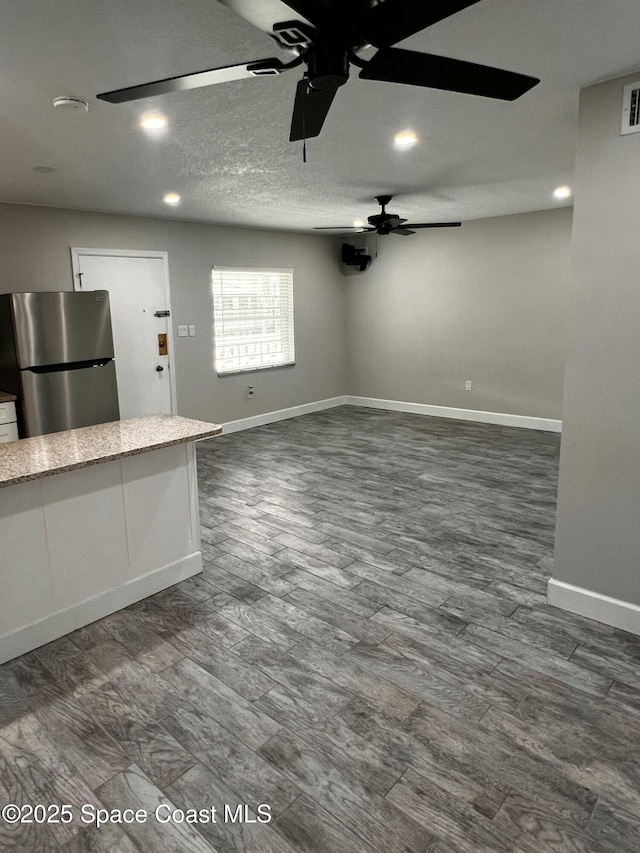 5600 N Banana River Blvd Unit 38, Cocoa Beach, FL 32931 - unfurnished living room featuring ceiling fan, dark wood finished floors, and recessed lighting