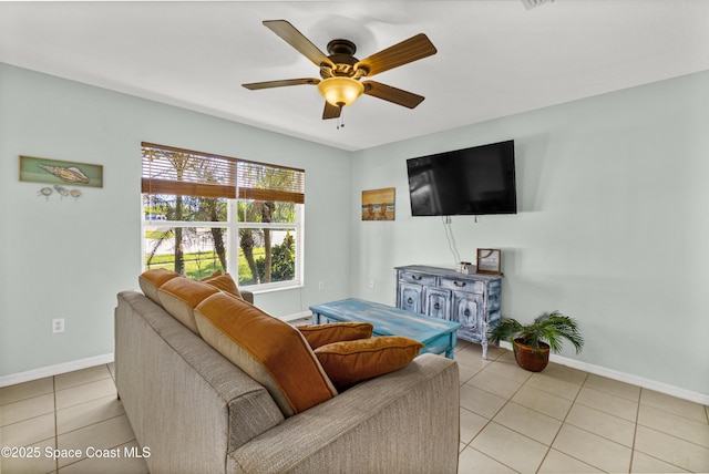 105 Ocean View Ln, Melbourne, FL 32903 - living area with light tile patterned floors and a ceiling fan