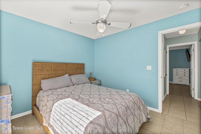 105 Ocean View Ln, Melbourne, FL 32903 - bedroom with tile patterned floors and a ceiling fan