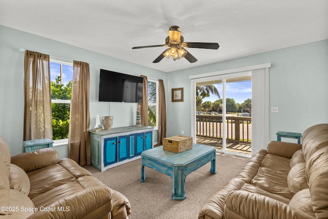 105 Ocean View Ln, Melbourne, FL 32903 - carpeted living area with a ceiling fan and plenty of natural light