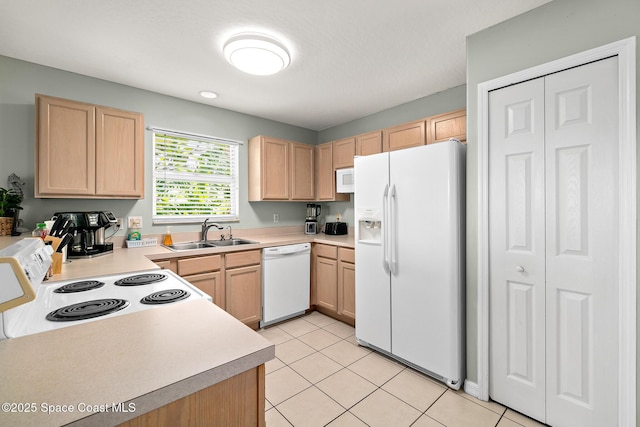 105 Ocean View Ln, Melbourne, FL 32903 - kitchen with white appliances, light brown cabinetry, and light countertops