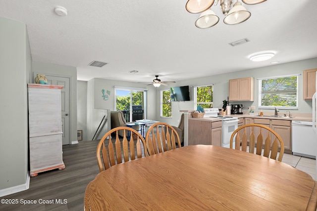 105 Ocean View Ln, Melbourne, FL 32903 - dining space with a ceiling fan, a chandelier, and wood finished floors