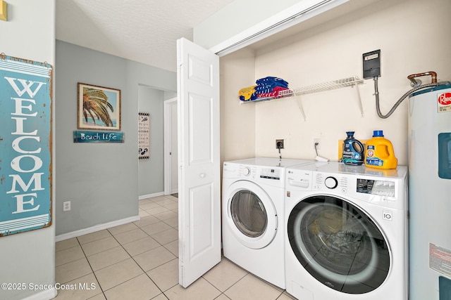 105 Ocean View Ln, Melbourne, FL 32903 - washroom with electric water heater, washing machine and clothes dryer, and light tile patterned floors
