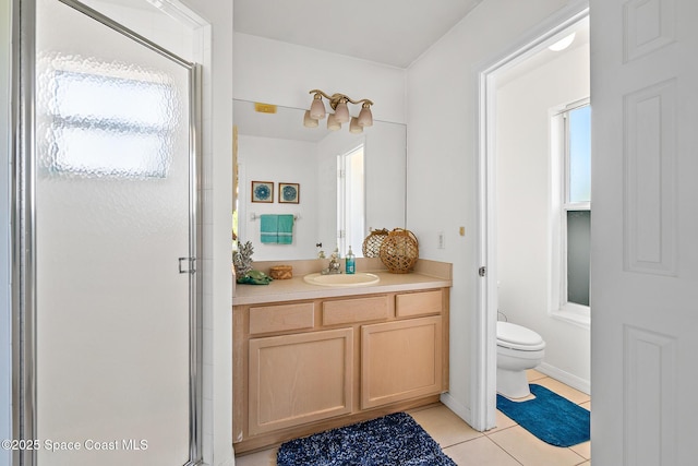 105 Ocean View Ln, Melbourne, FL 32903 - bathroom featuring tile patterned floors, vanity, a stall shower, and healthy amount of natural light