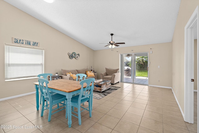 147 Ocean View Ln, Melbourne, FL 32903 - dining room with a ceiling fan, vaulted ceiling, and light tile patterned flooring