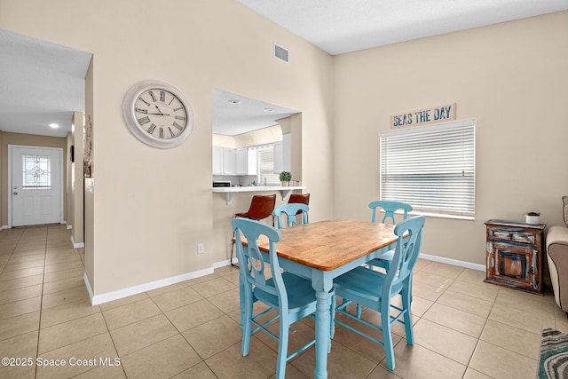147 Ocean View Ln, Melbourne, FL 32903 - dining room featuring light tile patterned floors