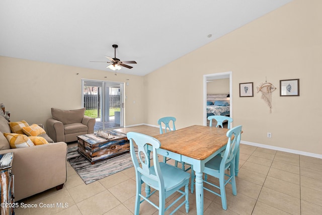 147 Ocean View Ln, Melbourne, FL 32903 - dining area with light tile patterned floors, ceiling fan, vaulted ceiling, and french doors