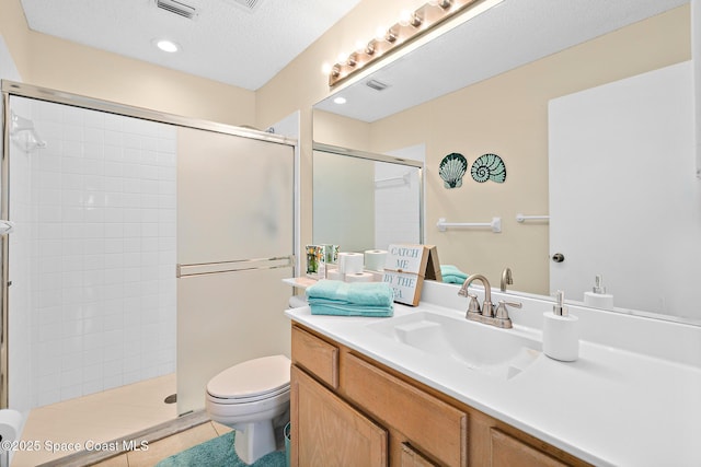 147 Ocean View Ln, Melbourne, FL 32903 - full bath featuring vanity, a shower stall, tile patterned floors, and a textured ceiling