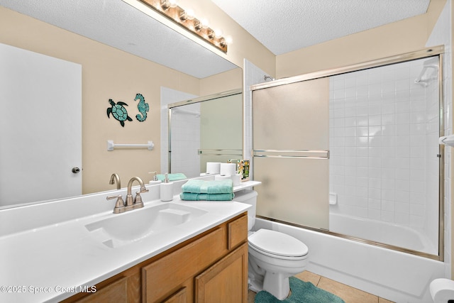 147 Ocean View Ln, Melbourne, FL 32903 - full bath featuring vanity, tile patterned flooring, enclosed tub / shower combo, and a textured ceiling