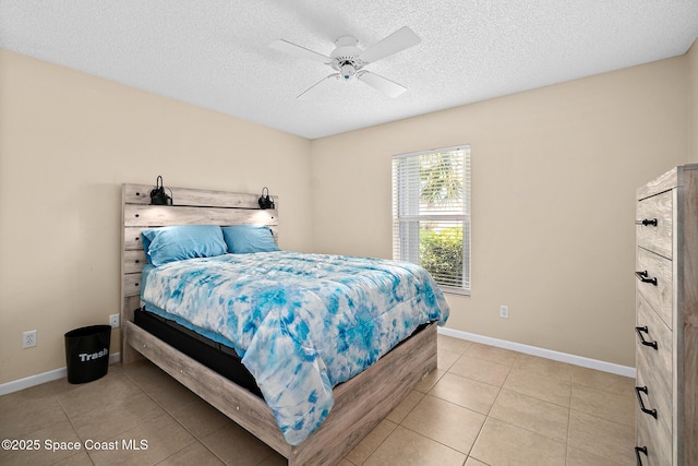 147 Ocean View Ln, Melbourne, FL 32903 - bedroom with a textured ceiling, light tile patterned floors, and ceiling fan