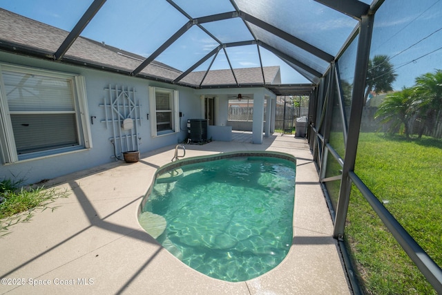147 Ocean View Ln, Melbourne, FL 32903 - swimming pool featuring a patio area, ceiling fan, and a lanai