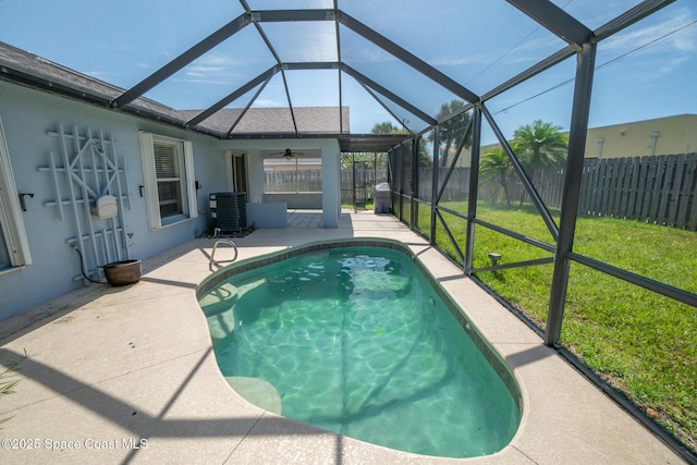 147 Ocean View Ln, Melbourne, FL 32903 - view of pool with a patio, a fenced backyard, ceiling fan, and a lanai