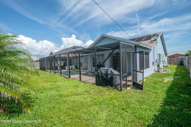 147 Ocean View Ln, Melbourne, FL 32903 - rear view of property with glass enclosure and a patio area