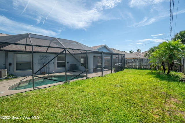 147 Ocean View Ln, Melbourne, FL 32903 - fenced backyard with a patio and glass enclosure