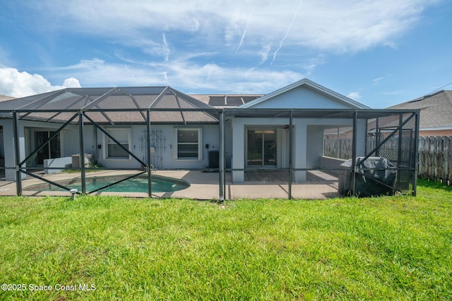 147 Ocean View Ln, Melbourne, FL 32903 - back of house featuring a patio area, stucco siding, and glass enclosure