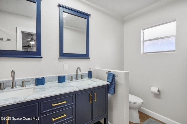 513 Ronnie Dr, Indian Harbour Beach, FL 32937 - bathroom featuring double vanity and wood finished floors