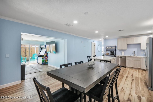 513 Ronnie Dr, Indian Harbour Beach, FL 32937 - dining room featuring ornamental molding, light wood-type flooring, and recessed lighting