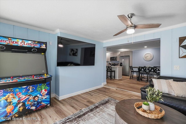 513 Ronnie Dr, Indian Harbour Beach, FL 32937 - living area with light wood-style floors, ornamental molding, and a ceiling fan