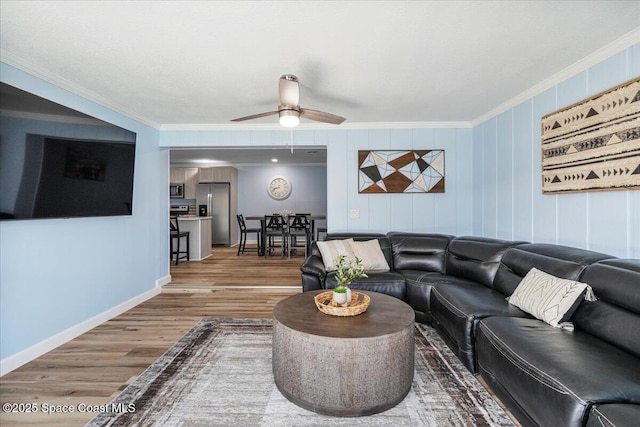 513 Ronnie Dr, Indian Harbour Beach, FL 32937 - living room featuring crown molding, wood finished floors, and ceiling fan