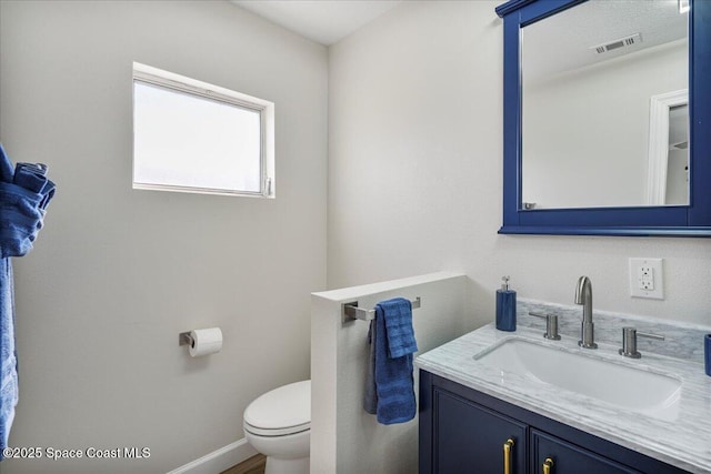 513 Ronnie Dr, Indian Harbour Beach, FL 32937 - half bath featuring toilet and vanity