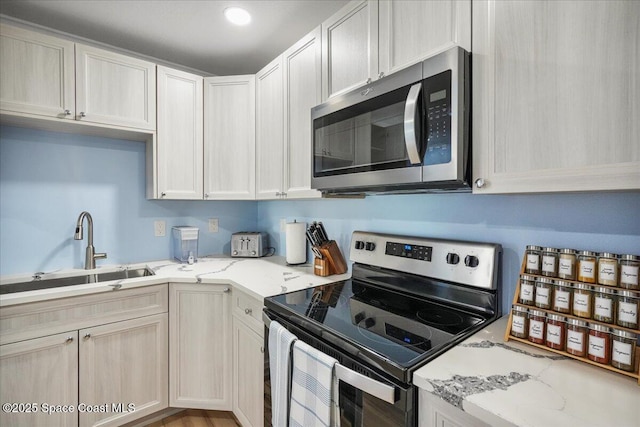 513 Ronnie Dr, Indian Harbour Beach, FL 32937 - kitchen with stainless steel appliances and light stone counters