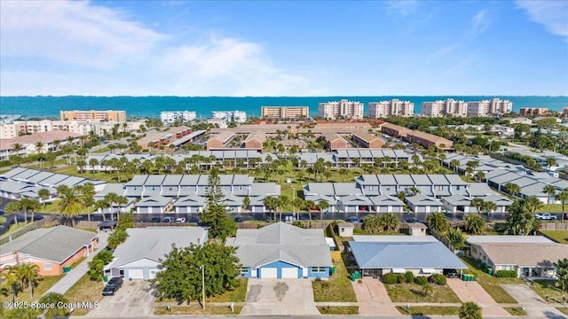 513 Ronnie Dr, Indian Harbour Beach, FL 32937 - aerial perspective of suburban area featuring a large body of water