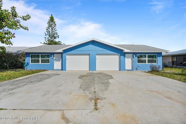 513 Ronnie Dr, Indian Harbour Beach, FL 32937 - ranch-style house featuring an attached garage and concrete driveway