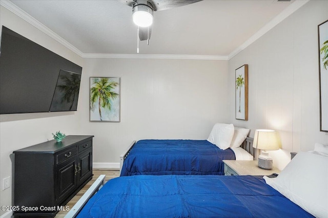 513 Ronnie Dr, Indian Harbour Beach, FL 32937 - bedroom with light wood-style flooring, ornamental molding, and a ceiling fan