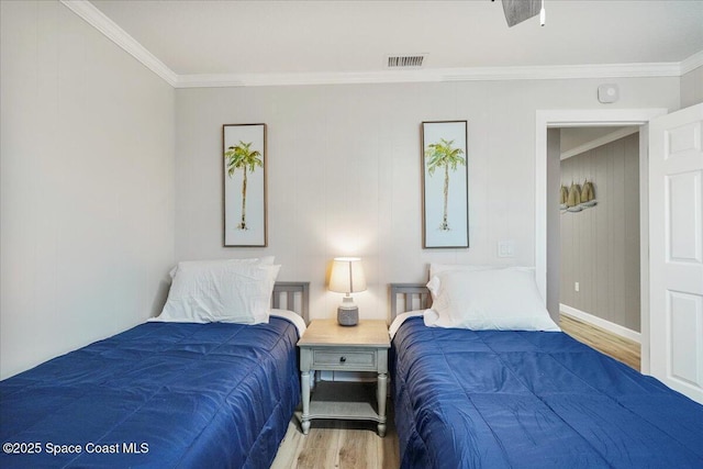 513 Ronnie Dr, Indian Harbour Beach, FL 32937 - bedroom with wood finished floors and crown molding