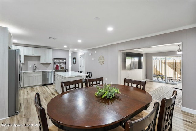 513 Ronnie Dr, Indian Harbour Beach, FL 32937 - dining space featuring ornamental molding, light wood-style floors, and recessed lighting