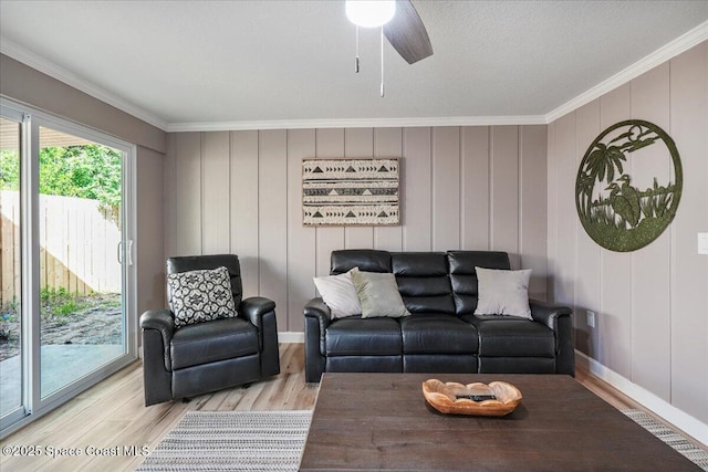 513 Ronnie Dr, Indian Harbour Beach, FL 32937 - living area with ornamental molding, light wood finished floors, ceiling fan, and a decorative wall