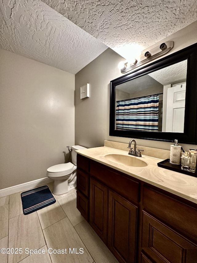 2190 Forest Knoll Dr NE Unit 90-202, Palm Bay, FL 32905 - bathroom featuring vanity, a textured ceiling, and curtained shower