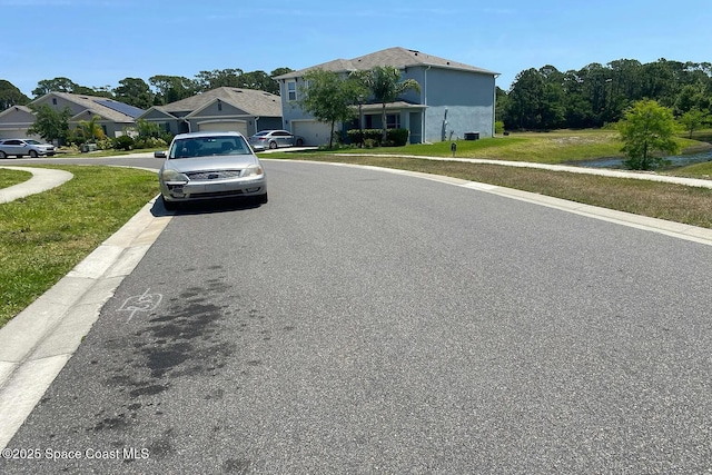 160 Old Mill Pond Rd, Edgewater, FL 32141 - view of asphalt street with curbs, sidewalks, and a residential view