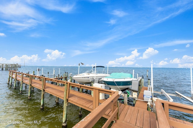 3360 S Atlantic Ave Unit 212, Cocoa Beach, FL 32931 - dock area featuring boat lift and a water view