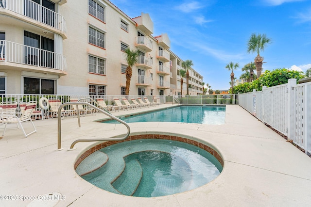 3360 S Atlantic Ave Unit 212, Cocoa Beach, FL 32931 - community pool featuring a community hot tub and a patio