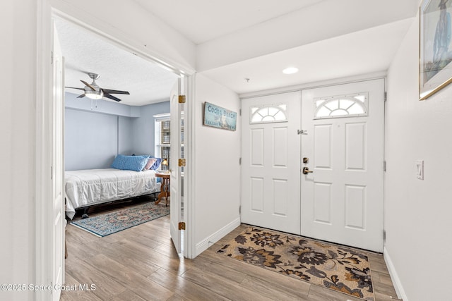 3360 S Atlantic Ave Unit 212, Cocoa Beach, FL 32931 - foyer with wood finished floors and ceiling fan