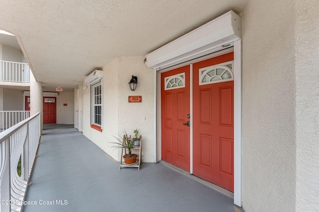 3360 S Atlantic Ave Unit 212, Cocoa Beach, FL 32931 - view of exterior entry featuring stucco siding